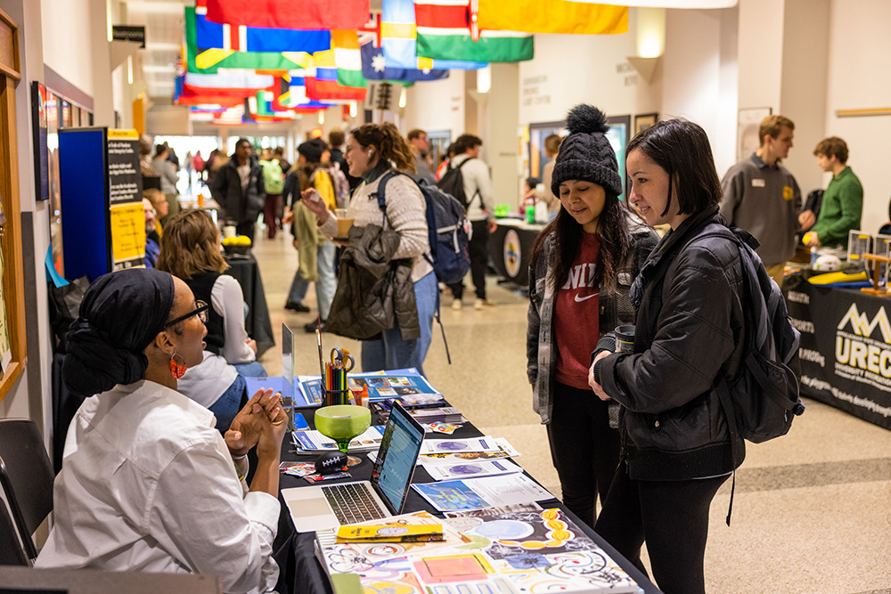 Students at a club expo, International Hallway of Plemmons Student Union